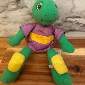 Green Turtle Franklin Plush with Purple Shirt and Yellow Accents